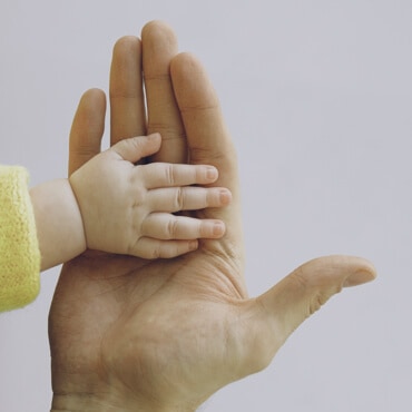 father and baby hands