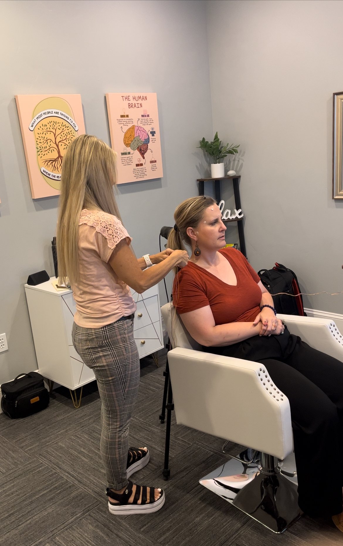 A Clear Mind Utah practitioner placing neurofeedback sensors on a client during an IASIS MCN session in American Fork, Utah