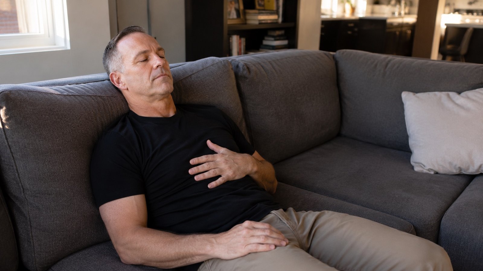 Troy Gundersen, owner of Clear Mind Utah, practicing morning breathwork on his recliner couch as part of his daily nervous system routine